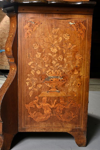 null A piece of furniture with two bodies forming a display case decorated with marquetry...