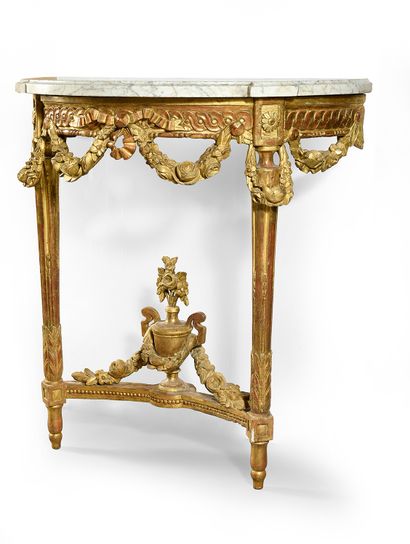 null Wall console in carved and gilded wood, it rests on two fluted and filleted...