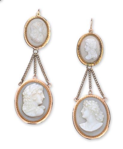 A pair of gold earrings with oval agate medallions...