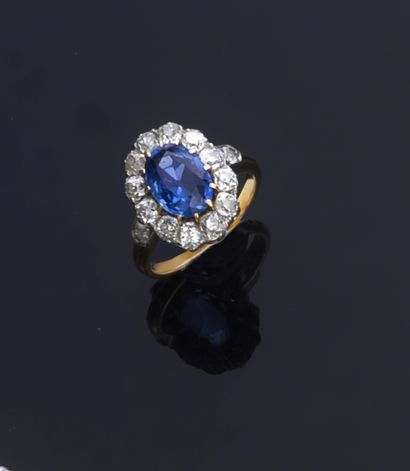 null A two-tone gold Pompadour ring, set with an oval sapphire (approx. 3 ct) in...