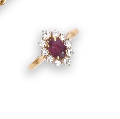 null Pompadour ring in gold 750e, decorated with an oval ruby in a diamond setting....
