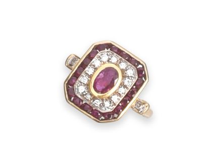 null Gold ring 750th decorated with an oval ruby in closed setting in a double octagonal...