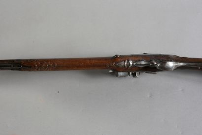 null Rifle, flintlock and flat-bodied, lightly engraved and signed, octagonal barrel...