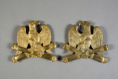null Set of two gilded brass prints with eagle motif on crossed barrels, First Empire...
