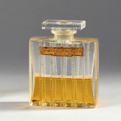 D'Orsay "Violette Ambrée" - (1920's)
Colorless pressed glass bottle of rectangular...