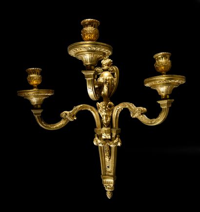 null Pair of sconces in chased and gilded bronze with three arms of lights, the shaft...