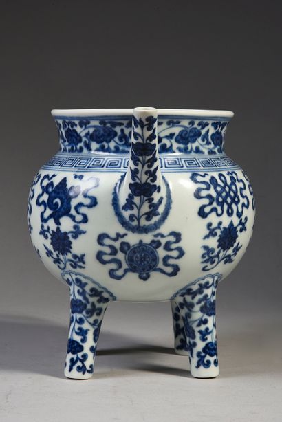 null Porcelain four-legged pot with white-blue decoration of Buddhist symbols.
Bears...