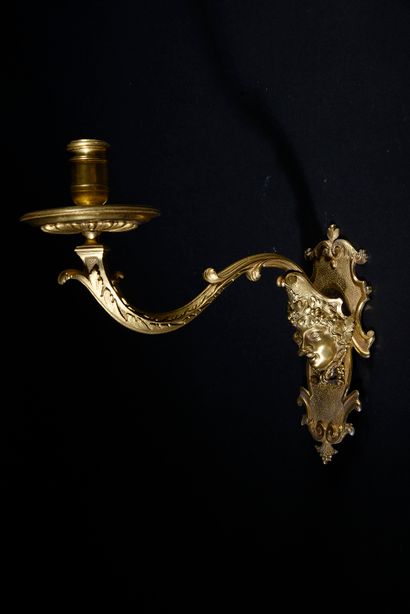 null Pair of chased and gilded bronze sconces with one arm of light, the cartouche-shaped...