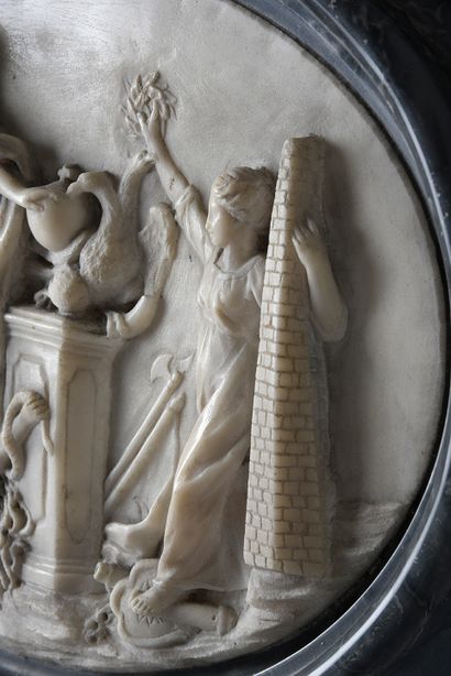 null Oval marble bas-relief representing Louis XIV overcoming his enemies; he rests...
