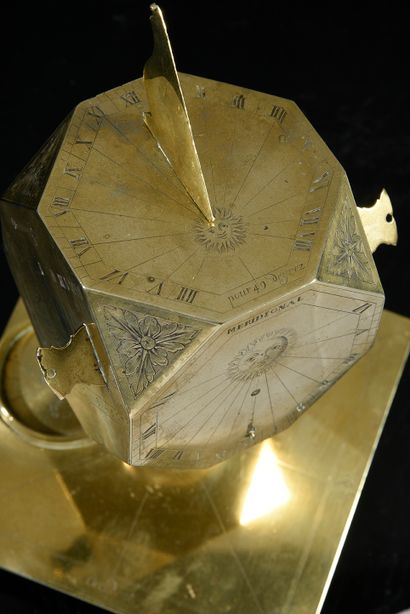 null Exceptional sundial of cubic shape with downturned angles in brass.
This polyhedron...