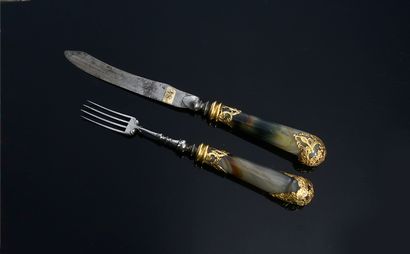 null Steel fork and knife with agate handle and gold application.
Holland, First...
