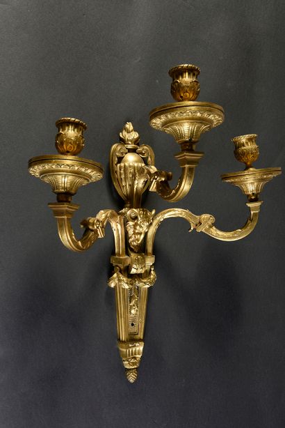 null Pair of sconces in chased and gilded bronze with three arms of lights, the shaft...