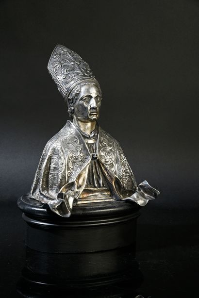 null Bust of a bishop in cast silver, embossed and engraved. He is wearing a high...