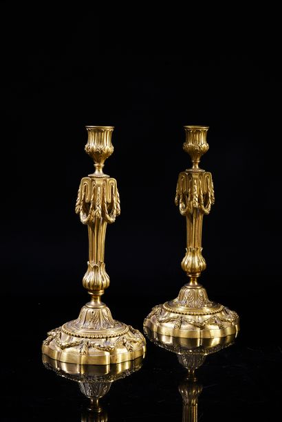 null Pair of chased and gilt bronze torches with neoclassical decorations of Greek,...