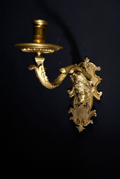 null Pair of chased and gilded bronze sconces with one arm of light, the cartouche-shaped...