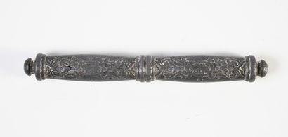 null A lead embossed level with traces of silver plating, in two parts, decorated...