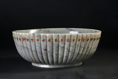 null Large hemispherical bowl with poly-lobed ribs in grey jasper with speckled rust...