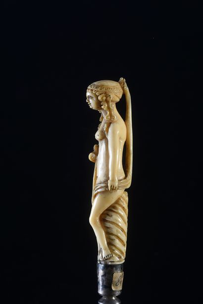 null Three-pronged fork with ivory handle carved in the round with a nude woman.
17th...