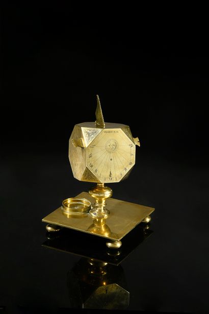 null Exceptional sundial of cubic shape with downturned angles in brass.
This polyhedron...