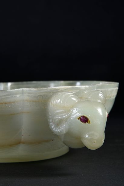 null Large flared bowl with a poly-lobed body in celadon nephrite jade infused with...
