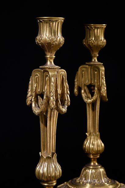 null Pair of chased and gilt bronze torches with neoclassical decorations of Greek,...