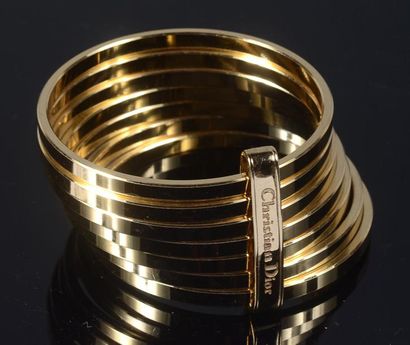CHRISTIAN DIOR Bracelet semainier en métal doré. Signé.
