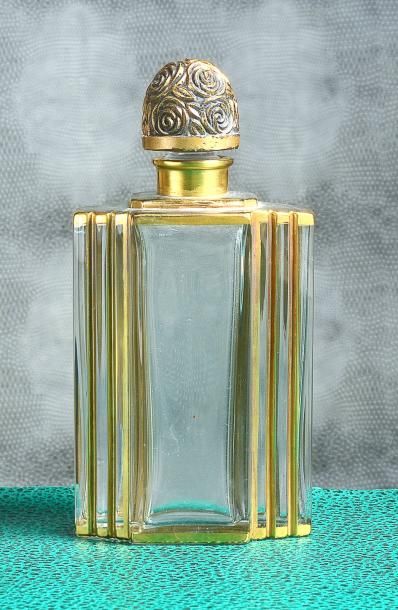 MAURICE BABANI - (1920) Elégant flacon moderniste en verre incolore pressé moulé...