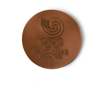 Séoul 1988. Médaille officielle de participant.
En...