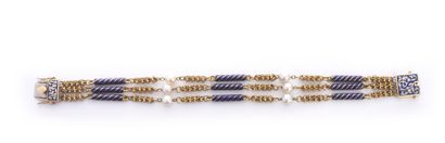 null Délicat bracelet en or 750e, à trois rangs à décor alterné de batônnets émaillés...