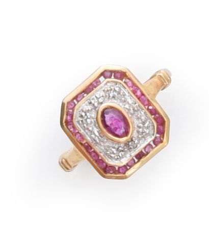 Gold ring set with an oval ruby in an octagonal...
