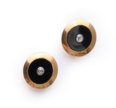 Pair of ear clips in gold 750, set with an...