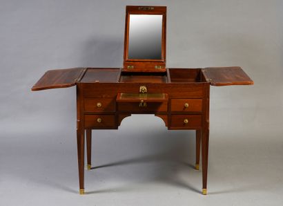 null Mahogany and mahogany veneer dressing table.
Sheath feet with bronze sabots...