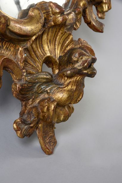 null Rocaille mirror in carved and gilded wood.
Italian work of the middle of the...