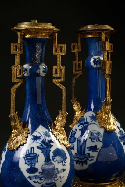 null A pair of Chinese porcelain vases of baluster form with a slight bulge on the...