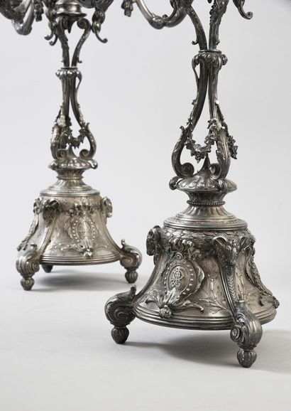 null A pair of silver candelabras 925e, with three arms and four lights, resting...