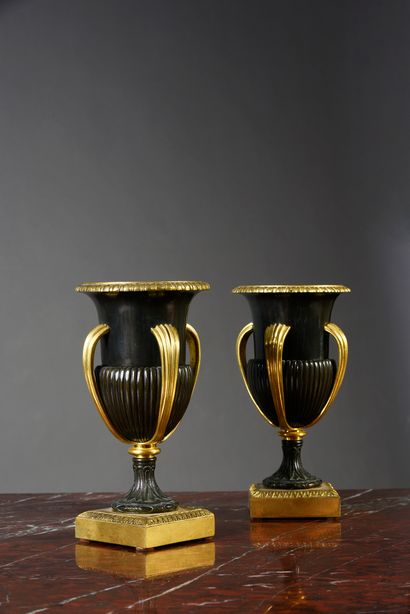 Pair of ornamental vases in patinated bronze...