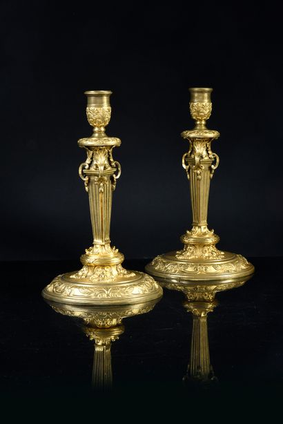 Pair of chased and gilded bronze candlesticks,...