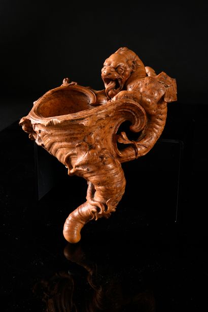 null Cedar burl cup carved in the round with a winged dragon drinking from a horn-shaped...