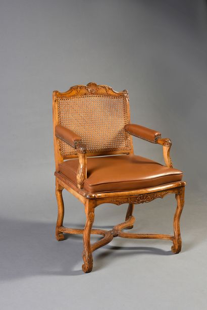 Armchair with cane bottom in molded and carved...