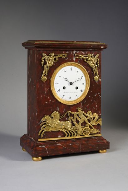 null Marble and gilt bronze clock decorated with Apollo on his chariot holding in...