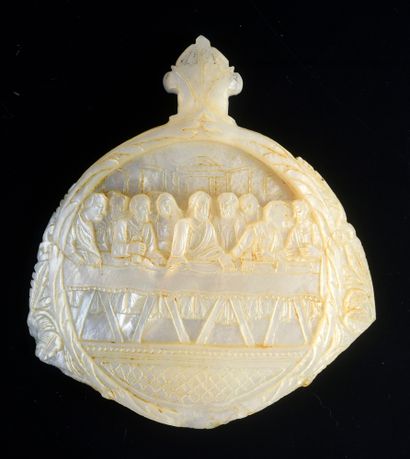 Two mother-of-pearl medallions carved in...