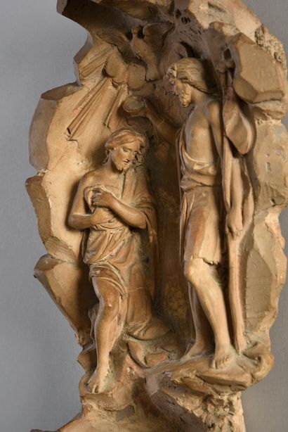 null Terracotta stoup representing on the backsplash the Baptism of Christ by St....