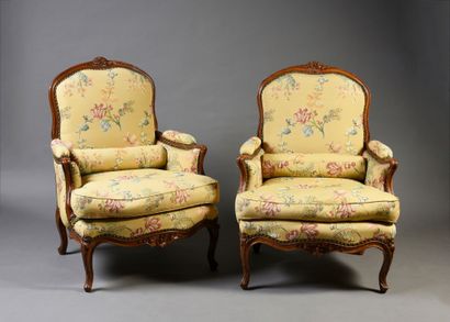 null Pair of molded and carved walnut bergères à la reine.
Short cambered legs with...
