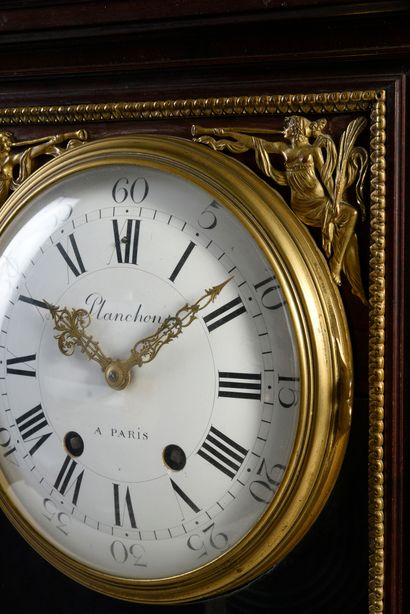 null Mahogany clock with brass fillet decoration, the movement on a glass base decorated...