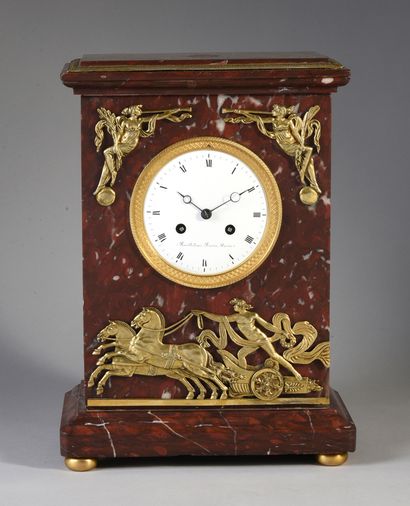 null Marble and gilt bronze clock decorated with Apollo on his chariot holding in...