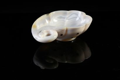 null Libatory cup carved in white agate and jaspered resting on a small foot engraved...
