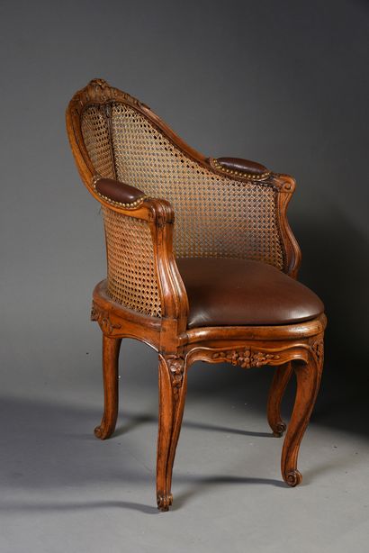 null Cabinet armchair with cane bottom in molded and carved beech.
Axial leg with...