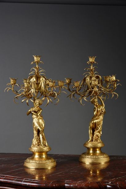Pair of gilt bronze candelabras with seven...