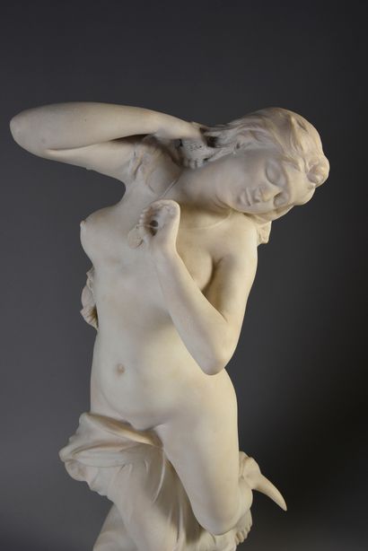 null White marble representing a young woman, her body undulating, her feet resting...