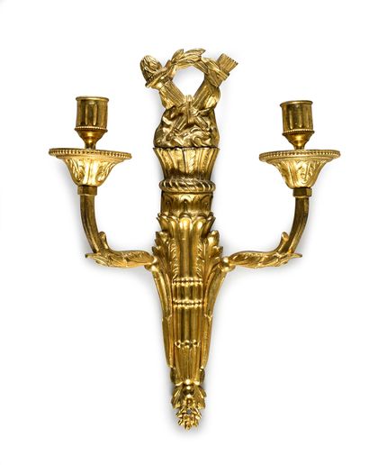 null Pair of sconces with two arms of light in chased and gilded bronze.
The shaft...